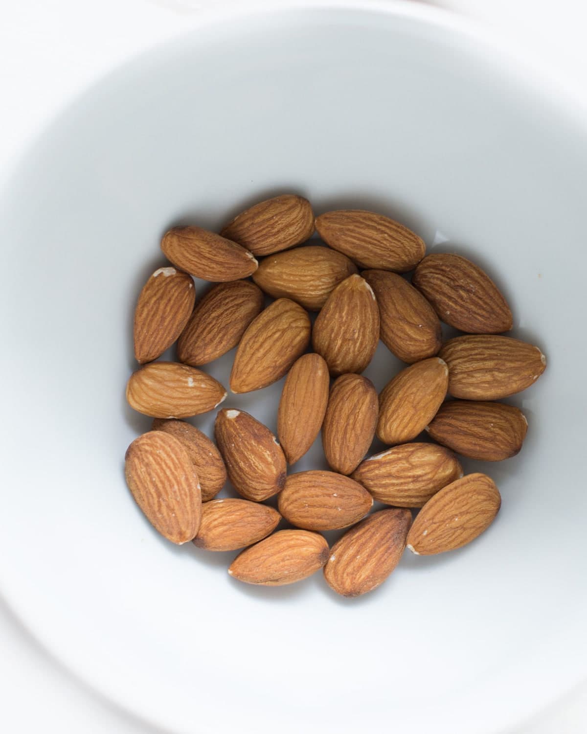 BM Noor almonds in a white bowl