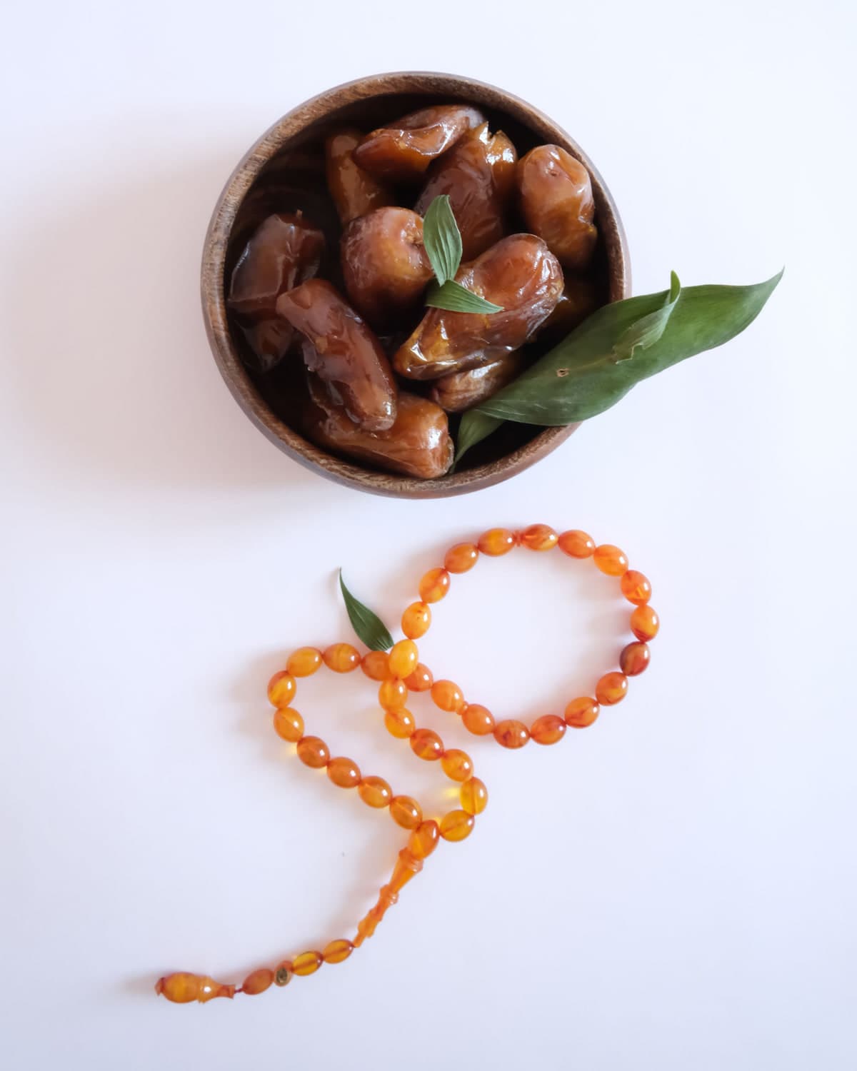BM Sogi dates in a bowl on white