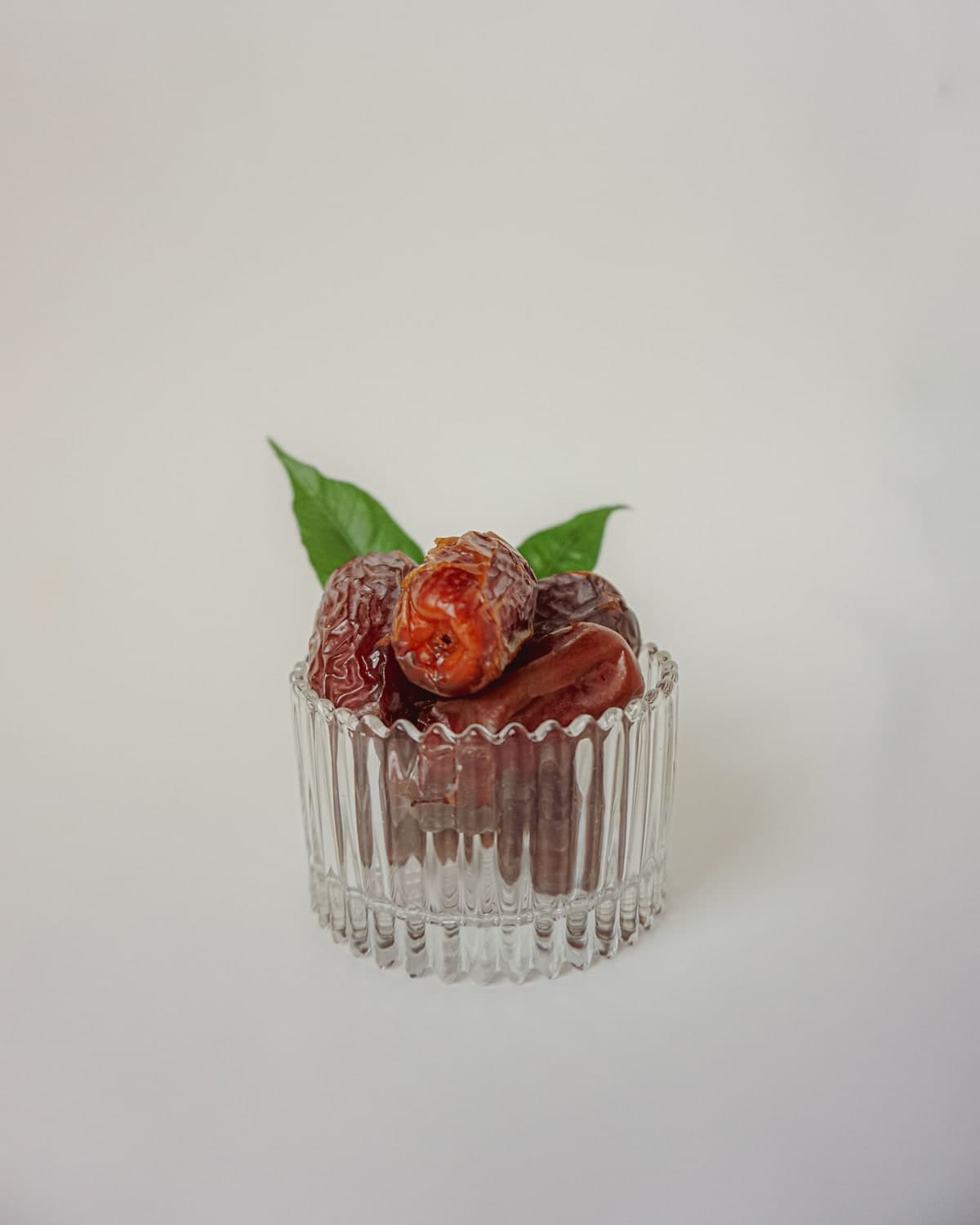 Soft BM Sukkari dates in a fluted glass