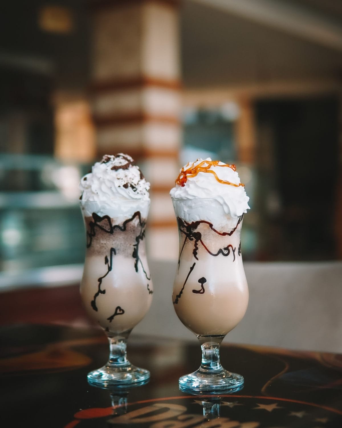 Two thick shakes topped with cream